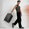 Charcoal grey small cabin suitcase with ridged shell, telescopic handle and 8 wheels