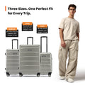 Silver wheeled suitcase set with telescopic handles, including a cabin-size case