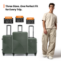 Set of dark green ribbed suitcases with telescopic handles and caster wheels
