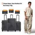 Charcoal grey medium check-in suitcase with four double wheels and telescopic handle