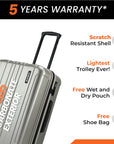 Silver small cabin suitcase close-up with scratch-resistant shell and telescopic handle.