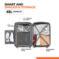 Open dark grey suitcase interior with packing space, straps, and water-resistant lining