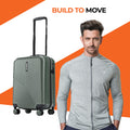 Dark green small cabin suitcase with 8 wheels and telescopic handle, ridged shell