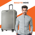 Large check-in suitcase with ribbed shell, 8 wheels, and upright handle, silver
