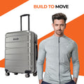 Hard-shell 8-wheel luggage in silver with upright handle and four spinner wheels