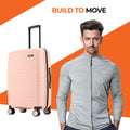 Peach small cabin suitcase with extendable handle and side wheels