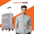 Medium check-in suitcase, grey shell with red trim and 8 spinner wheels.