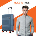 Medium check-in suitcase, blue shell with red trim and 8 spinner wheels.