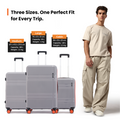 Small cabin suitcase with 8 wheels, grey shell and orange wheel accents