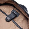 Black leather backpack interior laptop sleeve with snap strap and logo patch