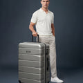 Large check-in suitcase, silver hard shell with 8 wheels and telescopic handle