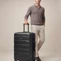 Medium check-in polycarbonate suitcase, black, 8-wheel, telescopic handle