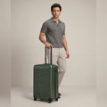 Dark green small cabin suitcase with ridged hard shell and 8 spinner wheels