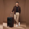 Black small cabin polycarbonate suitcase with 8 wheels and telescopic handle