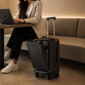 Black cabin laptop trolley on four spinner wheels with telescopic handle