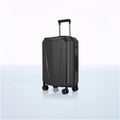 Dark hard-shell trolley luggage with telescopic handle and side latch details