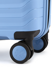 Blue suitcase corner with black caster wheels and sturdy frame