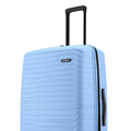 Blue hard-shell luggage with vertical side handle and ribbed shell texture