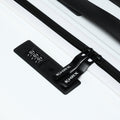 Large check-in suitcase zipper track and combination lock panel on white ribbed shell