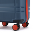 Blue cabin suitcase corner with 8 wheels, orange trim detail, and black wheel covers
