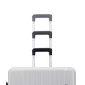 White hard-shell luggage with three telescopic handles and dark grip tops.