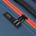 Blue hard-shell luggage top with zip pull, lock panel, and red zipper track