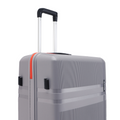 Hard-shell upright suitcase in grey with orange side stripe and black corner carry handle