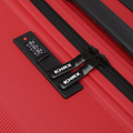 Red medium check-in suitcase: black lock dial and zipper pulls on ridged panel