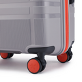 Grey hard-shell suitcase base with corner bumper and eight wheels, red-trimmed edge