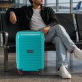Teal cabin trolley suitcase with 4 spinner wheels and telescopic handle