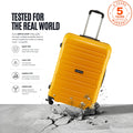 Yellow spinner trolley with telescopic handle and scuffed base
