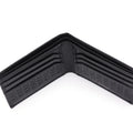 Black leather bi-fold wallet open with interior card-slot design