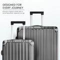 Stacked polycarbonate suitcases with telescopic handles, gray shell