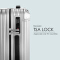 Silver polycarbonate suitcase with recessed TSA lock and combination keypad