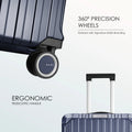 Close-up of blue suitcase spinner wheel with RARE branding and ribbed shell
