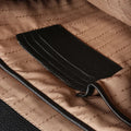 Black leather men’s bag interior pocket with stitched lining and leather strap