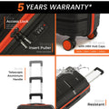 Small cabin suitcase details, black shell with orange wheels and telescopic handle