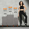Hard-shell luggage set of 2 with 8 wheels, light grey cases with orange caster accents.