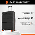 Hard-shell luggage in black with textured surface and 8 spinner wheels