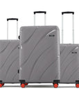 Hard body 3-piece luggage set, grey with four red wheels and telescopic handles