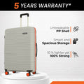Hard-shell luggage set of 2 with 8 wheels, light grey case with orange corner trim and wheels.