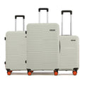 3-piece hard-shell luggage set in off-white with 8 spinner wheels and stackable handles