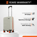 Cream small cabin suitcase with telescopic handle and four orange wheels on stand