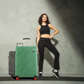 Large check-in suitcase, hard shell, green color, telescopic handle, 8 wheels, red accents