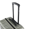 Silver metallic suitcase with black telescopic handle and top hand grip