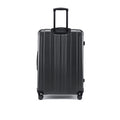 Hard-shell spinner suitcase with telescopic handle and corner bumpers, dark charcoal