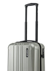 Small cabin suitcase with silver-green shell, extended trolley handle, and front corner detail.