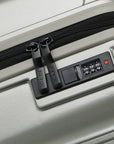 Small cabin suitcase with TSA-style combo lock detail and black zipper pull