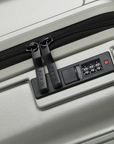 Small cabin suitcase with zipper and TSA-style lock panel, silver hard shell
