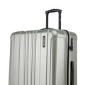 Silver hard-shell suitcase with vertical ridges and side control panel near handle